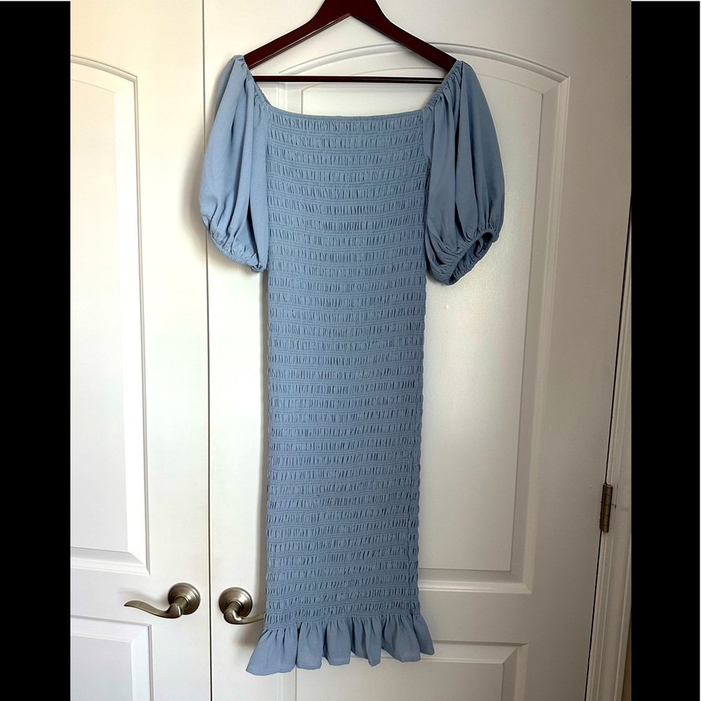 Dusty blue mid-length dress.